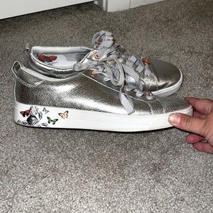 Ted Baker silver tennis shoes with butterfly accent, size 9.5, good cond. & cool